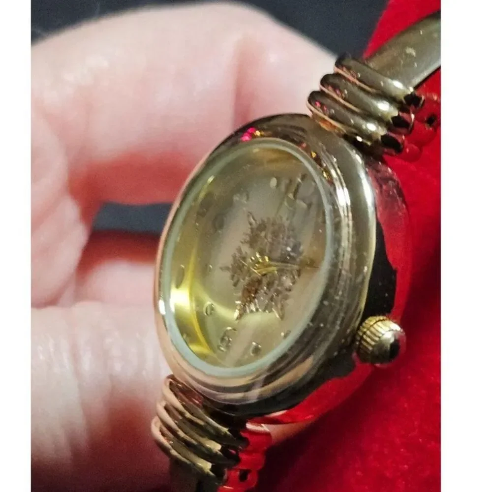 Holiday Lane gold tone snowflake watch